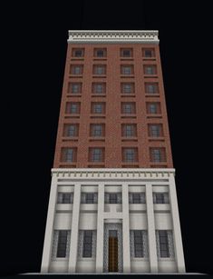 a tall brick building with many windows on it's sides and an open door at the top