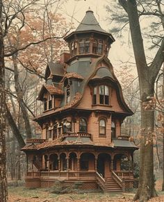 an old wooden house in the woods with stairs leading up to it's second story