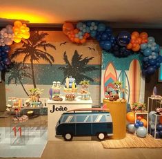 an image of a party setting with balloons and decorations on the wall, including a vw camper van