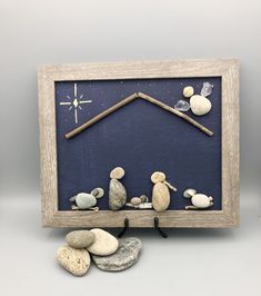 a nativity scene made out of rocks and wood