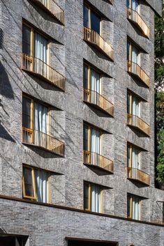 an apartment building with multiple balconies and windows