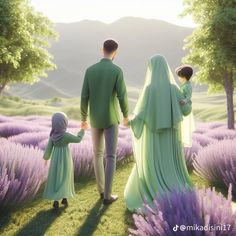 a man and woman holding hands while walking through lavender fields with their child in the foreground