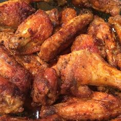 chicken wings cooking in a frying pan