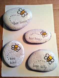 three rocks with bee sayings on them