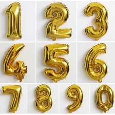 gold foil balloons in the shape of numbers and numerals for birthday party decorations