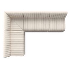 an upholstered white couch with the seat down on it's back end