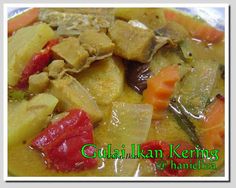 a close up of a bowl of food with meat and veggies in it