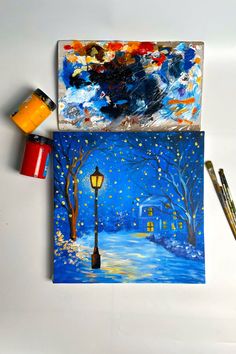 A canvas painting of a snowy night scene with glowing Christmas lights, featuring a lamppost and illuminated house in the background. Magical Christmas