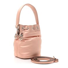 This is an authentic FENDI Nylon Ninfa Vitello King Cuoio Mini Mon Tresor Bucket Bag in Baby Pink. This chic tote is crafted of pink nylon with a pink trim and base. It features a waist-length leather shoulder strap, a leather top handle, silver hardware, and opens to a matching interior. Fendi Crossbody Bag, Pokemon Fabric, Fendi Shoulder Bag, Pink Trim, Fendi Bags, Blue Velvet, Waist Length, Baby Bag, White Bag