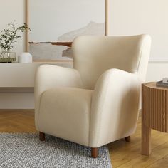 a white chair sitting on top of a wooden floor