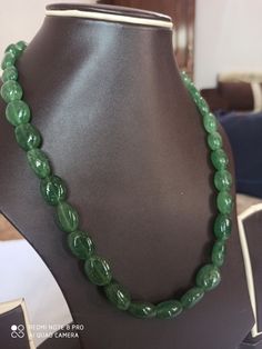 19'' AA Natural Green Strawberry Quartz 282 Carat Fine Quality Smooth Oval Beads Gemstone Necklace Stone :Natural Green Strawberry Quartz Shape :- Oval Size :- approx 6x8- 10x15 mm 1. Weight :- 282 carat - 21 inch Purity :- 100% Natural Gemstone Polish :- Handmade color - green makes a great gift for your loved ones. It is known as the 'love stone' as the message it emits is the strong vibration of unconditional love, joy, warmth and healing. As quartz crystals are profound amplifiers of energy, Oval Jade Necklace With Natural Stones, Green Oval Gemstone Beads Necklace, Green Oval Faceted Bead Necklaces, Handmade Oval Green Beaded Necklace, Oval Single Strand Beaded Necklace As Gift, Oval Single Strand Beaded Necklace For Gift, Green Oval Gemstone Bead Necklace, Green Oval Gemstone Beaded Necklace, Green Oval Gemstone Beaded Necklaces