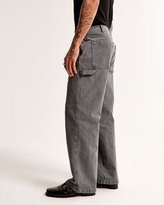 Our workwear pants in a stretchy canvas fabric and baggy fit through the leg, for an on-trend look. Features carpenter-style details like a hammer loop, wider belt loops, button and fly closure and back patch pockets. Features a longer inseam designed to puddle around the shoe. For a shorter visual, choose a shorter inseam. Versatile Gray, Workwear Pants, Male Style, Men's Bottoms, Wide Belt, Pocket Bag, Baggy Fits, Modern Man, Cotton Bag