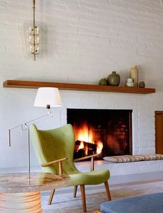 a living room filled with furniture and a fire place