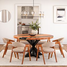 a dining room table with chairs around it