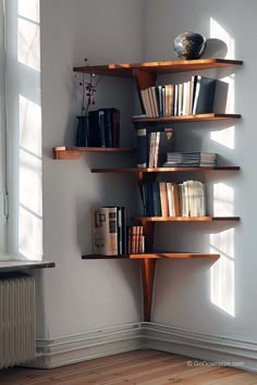 a bookshelf filled with lots of books on top of a hard wood floor