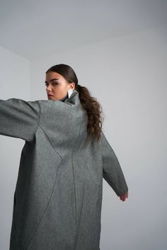 Step up your fashion game with our latest denim oversized midi coat, the perfect addition to any fashion-forward wardrobe.This stunning coat is the perfect combination of classic and modern style. The denim material provides a traditional look but with the oversized shape and midi length, this coat is anything but ordinary.Made from high-quality materials, the denim oversized midi coat is both durable and comfortable. The fabric is soft and easy to wear, while the oversized shape ensures that yo Oversized Wool Coat With Pockets For Work, Casual Oversized Wool Coat, Classic Oversized Outerwear For Everyday, Trendy Long Wool Coat For Spring, Trendy Oversized Outerwear, Oversized Long Coat With Pockets, Classic Oversized Pea Coat With Pockets, Oversized Wool Coat With Pockets For Spring, Oversized Wool Coat For Fall Workwear