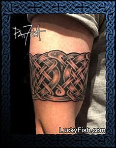 a man's arm with an intricate celtic tattoo design on his left forearm and shoulder