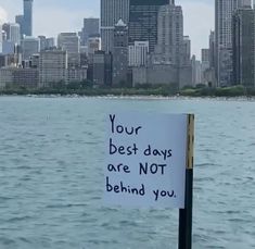 a sign that says your best days are not behind you in front of the city