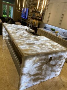 a large kitchen island in the middle of a room