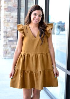 This corduroy dress has a ruffle sleeve, vneck, and tiered ruffle bottom! Perfect with western boots! Victoria is wearing a small. Tent Sale, Corduroy Dress, Hair Accessories Jewelry, Cardigan Jacket, Western Boots, Bottoms Pants, Jeans Pants, Homecoming Dresses, Vest Jacket