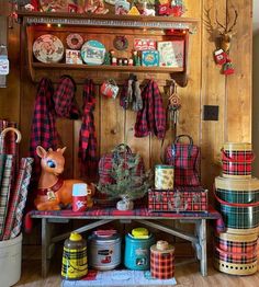 christmas decorations and gifts are displayed on the shelf in this rustic cabin - like room