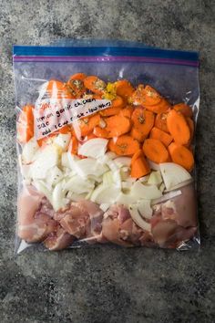 a bag filled with meat and vegetables on top of a counter