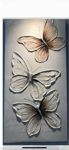 three butterflies are shown on a glass plaque with the words,'i am not sure what