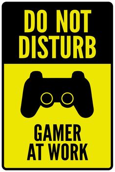 a sign that says do not disturb gamer at work