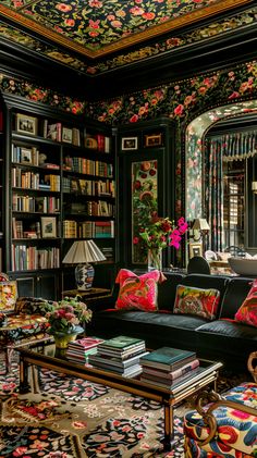 a living room filled with lots of books and furniture