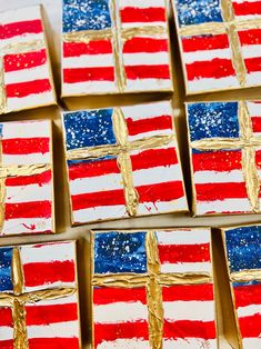 several small red, white and blue flags painted on gold foil