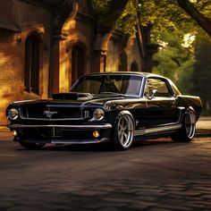 an old black car is parked on the street