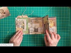 someone is making an altered book out of old paper and scrapbook pages with scissors