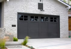 an image of a house with two garage doors