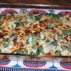 a casserole dish with broccoli and cheese