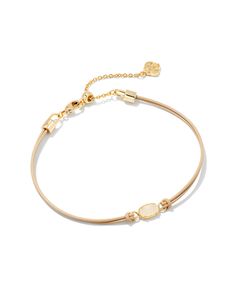 Give back in style with the Emilie Gold Corded Bracelet in Iridescent Drusy. A delicate and dainty addition to your wrist stack, this meaningful bracelet will easily become a part of your everyday layered look. Metal 14k Yellow Gold Over Brass Closure Lobster Clasp Size 6.5" Chain With 1.5" Extender, 3.5"L X 0.14"W PendantDue to the one-of-a-kind nature of the medium, exact colors and patterns may vary slightly from the image shown. | Kendra Scott Emilie Gold Corded Bracelet in Iridescent Drusy Dainty Pink Bracelet, Wrist Stack, Icon Jewelry, Kendra Scott Bracelet, Rose Gold Pendant Necklace, Wrist Stacks, Amazon Wishlist, Solitaire Rings, Ring Watch