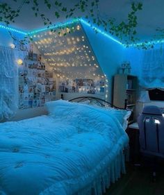 a bedroom with lights strung from the ceiling