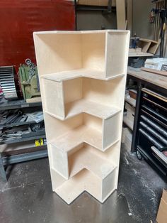 an unfinished shelving unit in a workshop