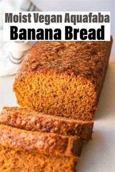 a loaf of banana bread on top of a white plate with the words, most vegan aquafaba banana bread