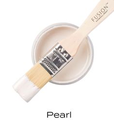 a paint brush with the words pearl on it and an image of a white bowl