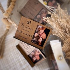 a couple's wedding pictures are hanging on the wall next to flowers and candles