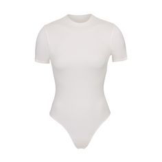 A versatile t-shirt bodysuit that offers light level of compression and smoothing. This style is made to wear alone or under clothing as the perfect base layer. White High Stretch Short Sleeve Bodysuit For Summer, White Short Sleeve Stretch Bodysuit, White Stretch Short Sleeve Bodysuit, White Stretch Elastane Bodysuit, White Fitted Short Sleeve Basic Bodysuit, White Smoothing Shapewear Bodysuit, White Fitted Shapewear Bodysuit, White Seamless Elastane Bodysuit, White Fitted Smoothing Bodysuit