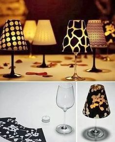 three different lamps and two wine glasses sitting on a table with the same lamp shade