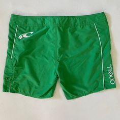 >> Please purchase based on the garment's measurements, these are taken lying flat and doubled at the waist and hips. << Y2K O'neill green and white boardshorts with a logo down the side and on the back. White trim, a Velcro side pocket and a Velcro fly with a shoelace tie. Excellent condition.  Tag size 13. Estimated fit: true or a size large  Waist: 36" Rise: 10" Hips: 46" Thigh - widest: 13" Inseam: 6" 100% polyester  > Please read prior to purchase < * Don't hesitate to contact me if you need additional measurements or have any questions about condition or fit.  * Refer to the measurements, item description, and return policy prior to purchasing.  * In order to reduce waste, I do not include print outs or excessive packaging materials. Each garment is carefully cleaned prior to shippin Green Short Swimwear For Surfing, Casual Swim Trunks With Short Legs, Casual Short-leg Swim Trunks, Green Sporty Surfing Shorts, Sporty Green Surfing Shorts, Green Short Swim Trunks For Surfing, Casual Green Swimwear With Built-in Shorts, Green Beachwear Shorts For Outdoor, Fitted Casual Surfing Bottoms