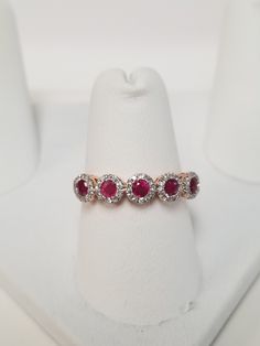 "Thanks for shopping our vintage estate store. We tend to sell well below wholesale and truly hope you enjoy all of our items. Many of the items are one of a kind, so please enjoy scrolling through the pictures and hopefully something will catch your eye. Brown spots are from camera or reflections. Estate 14k rose gold natural .40ct ruby and .20ct diamond wedding band or ring. It's stunning and one that you will love. Gem is testing natural ruby. Diamonds are very small .01ct each. Ring size: 7 Rose Gold Ruby Ring With Brilliant Cut Diamond, Classic Rose Gold Diamond Ruby Ring, Classic Rose Gold Ruby Ring With Diamond, Classic 14k Rose Gold Ruby Ring For Anniversary, Diamond Accented Ruby Ring In Rose Gold, Rose Gold Ruby Ring With Diamond Round Band, Rose Gold Ruby Ring With Diamond Accents, Rose Gold Ruby Ring With Diamond Halo Design, Rose Gold Diamond Ruby Ring With Halo Design