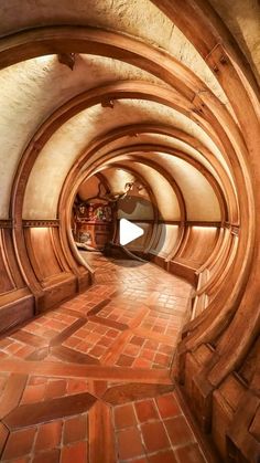 the inside of a tunnel with brick flooring