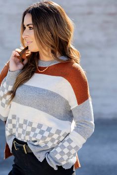 Sweater weather is upon us and we're in love with this one! The fun stripes and the checkered printed bottom are so simple yet so chic! Pair this sweater with jeans, accessorize and add your favorite pair of shoes for a quick, stylish look! Chilly? Add a vest or jacket with ease!!100% Polyester Hand wash cold. Lay flat to dry. Trendy Striped Sweater For Fall, Trendy Plaid Sweater For Fall, Casual Plaid Sweater For Layering, Trendy Contrast Stripe Sweater For Fall, White Striped Hem Sweater For Fall, Chic Fall Sweater With Contrast Stripes, Striped Sweater For Everyday In Fall, Sweater With Jeans, Fashion 2024