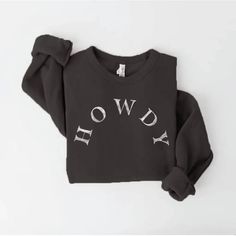 Introducing our "Howdy" sweatshirt, a cozy and cheerful garment that captures the heartwarming spirit of a Texan welcome. Remarkably soft, heather dust fabric spun from plush sponge fleece Hand screen-printed with water-based ink utilizing the technique of soft printing HOWDY is on the front center in white Comfortable, oversized fit with ribbed cuffs and waistband We can't keep this sweatshirt in stock! Made in the USA Guaranteed to be your favorite, go-to! Remember words have power and energy- Words Have Power, Weekend Style, Hand Screen Printed, Black Media, Water Based Ink, Oversized Fits, Life Changes, Screen Printing, Comfort Fit