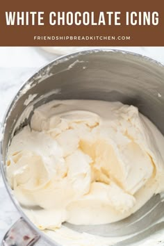 a white chocolate icing in a silver bowl with the words, how to make white chocolate icing