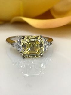 Canary Yellow Asscher Cut With Trillion Accents Engagement Wedding Anniversary Promise Ring 3.50ctw Solid 14kt White Gold #4843 Classic Trillion Cut Diamond Ring Gia Certified, Gia Certified Trillion Cut Cubic Zirconia Ring, Asscher Cut Diamond Rings With Side Stones, Elegant Yellow Asscher-cut Ring, Elegant Yellow Asscher Cut Ring, Elegant Asscher Cut Ring With Side Stones, Yellow Asscher Cut Diamond Ring Fine Jewelry, Elegant Asscher Cut Rings With Side Stones, Asscher Cut Yellow Diamond Wedding Ring