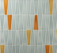 an orange and blue tiled wall with different colors